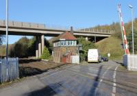 The Furness Railway signal box at Park South, which controls the junction, level crossing and associated semaphores.  This view looks north towards Askam with the once quiet valley now dominated by the bridge carrying the A590 into Barrow.<br><br>[Mark Bartlett 04/11/2013]