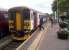 The train staff and passenger at Chappel and Wakes Colne (old branch line economics) seem to have lost something. They didnt find it before the 14.39 left for Marks Tey. The location of the viaduct is indicated by the slewed track in the background.<br><br>[Ken Strachan 20/07/2013]