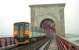 A Sprinter heads north to Kirkcaldy on the Forth Bridge in 1995. This photograph was taken during an inspection of the removal of bird lime. The track nearest the camera was closed at the time. If a train came we were asked to face the fence, place our arms over it and hold on. When a train finally came it was a tamper, going northbound at almost no speed, nonetheless we did as instructed.<br><br>[Ewan Crawford //1995]