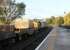 The morning Crewe to Sellafield flasks rumble through Grange-over-Sands station behind DRS EE Type 3s 37608 and 37682 on 17 October 2013.<br><br>[Mark Bartlett 17/10/2013]