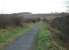 Looking across Knitsley embankment in the direction of Lanchester in November 2012. This huge colliery spoil and spent ballast construction replaced a 700' long wooden trestle viaduct around the time of WWI. The Consett to Durham line finally closed completely around 1964 and is now one of a number of County Durham cycleways that follow old railway lines. <br><br>[Mark Bartlett 27/11/2012]