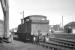 Adams class O2 0-4-4T no 30193 standing alongside the rail mounted crane on the south side of Plymouth Friary shed in August 1961 [see image 42737]. [Ref query 8349]<br><br>[K A Gray 17/08/1961]