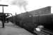 The 8.50am Blackpool Central - Glasgow Central waits at Carlisle platform 1 on a summer Saturday in July 1964 while Black 5 44662 takes on water.<br><br>[K A Gray 04/07/1964]