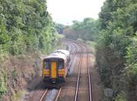 A pair of Northern single units approaching Silverdale level crossing in September 2012 heading for Carnforth and Lancaster with a Cumbrian Coast service.<br><br>[Mark Bartlett 03/09/2012]