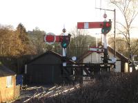 The station approach signal bracket and signal box at Llanfair Caereinion on 20 January 2014.<br><br>[David Pesterfield 20/01/2014]