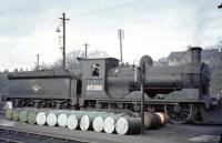 Snowplough-fitted J36 0-6-0 no 65288 seems to be over a barrel on its home depot at 62C Dunfermline on 30 March 1964. 65288 was one of the last two steam locomotives to be (officially) withdrawn by BR Scottish Region in June 1967.<br><br>[John Robin 30/03/1964]