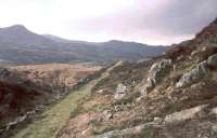 Before the first Moelwyn tunnel was built, there were two temporary inclines between Tan-y-Grisiau and Dduallt. This is the track of the southern incline in May 1968 - the deviation and new tunnel are a few metres to the west.<br><br>[John Thorn /05/1968]