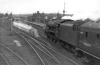 A <I>Royal Scot</I> drifts into Beattock station with a down Anglo - Scottish express in the early 1960s. The train will take on banking assistance here before tackling the climb north. <br><br>[David Stewart //]