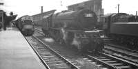 An EE Type 4 prepares to take out the 9.20am Crewe - Aberdeeen from Carlisle on 4 August 1962. Standing alongside is Stanier Pacific 46208 <I>Princess Helena Victoria</I>, which had brought in the train from the south [see image 32298]. Ivatt class 4 no 43027 is on the right of the picture. <br><br>[K A Gray 04/08/1962]