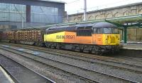 Colas Railfreight 56087 passing through Carlisle station on 5 February 2014 with the Kingmoor - Chirk log train.<br><br>[Ken Browne 05/02/2014]
