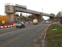 The new Borders Railway bridge at Hardengreen complete with deck, seen from the south on Monday morning 17 February, with the road reopened and traffic back to normal on the A7 after the weekend closure. <br><br>[John Furnevel 17/02/2014]