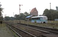 Until late 2002 Heudeber-Danstedt was a junction on the Halberstadt - Wernigerode - Goslar cross-country line, with a branch striking off north-westwards to Osterwieck. Not long before closure in late 2002, single-unit former DR <i>piglet taxi</i> No. 772 345 approaches the weed infested branch platform at Heudeber-Danstedt with a late afternoon working from Osterwieck-West. The branch can be seen diverging to the right of the signal-box in the left background. <br><br>[Bill Jamieson 17/08/2002]