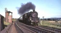 Kingmoor Black 5 no 45112 passing Craigenhill signal box on 16 July 1965 hauling a down train of empty coaching stock. Note the burnt smokebox door. <br><br>[John Robin 16/07/1965]