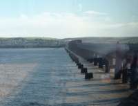 View from an Aberdeen to Edinburgh service on the north curve of the Tay Bridge. The stumps of the original structure, in various stages of decay, can be seen clearly from southbound trains all the way across the firth.<br><br>[Mark Bartlett 07/03/2014]