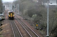 Signs of progress on the electrification of the Whifflet line at Mount Vernon on 17 March as the 0845 service to Glasgow Central approaches the station. Electrification of the line to Whifflet is due to be completed this summer.<br><br>[Colin McDonald 17/03/2014]
