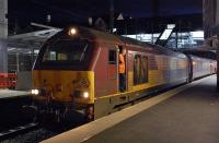 67004 and driver await the right-away at Haymarket with the returning Fife commuter train on the evening of 17 March.<br><br>[Bill Roberton 17/03/2014]