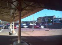 Looking out from the well preserved awning at Wolverhampton Low Level station in the afternoon sun on 16 March, as a class 321 unit draws into the current High Level station in the background. [See image 36283]<br><br>[Ken Strachan 16/03/2014]