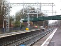 An updated Cumbernauld station on 21 February 2014, complete with new OLE equipment and a new footbridge. Note the extension to platform 1 to accommodate longer electric units.<br>
[see image 19133] <br><br>[Colin Harkins 21/02/2014]