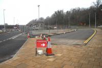 Changes to the Galashiels road layout in March 2014 to make way for the new interchange [see image 44638]. View north with the station site on the east side of Ladhope Vale alongside the pedestrian crossing in the right background. To the left is the rerouted Stirling Street, now running through the centre of the former bus station.<br><br>[John Furnevel 31/03/2014]