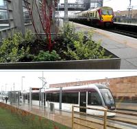Train and tram at Edinburgh Park station on 2 April 2014. The station planters here have been adopted by the Rotary Club of Edinburgh.<br><br>[John Yellowlees 02/04/2014]