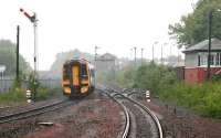 An early afternoon Edinburgh Waverley - Dunblane ScotRail service heads north away from Larbert in May 2005 during a period of exceptionally heavy rain.<br><br>[John Furnevel 25/05/2005]