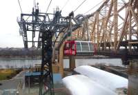 New York's Roosevelt Island Tramway in March 2014, with the borough of Queens on the far side of the East River, Manhattan behind the camera and the Queensborough Bridge on the right. Opened in 1976 to coincide with the development of low cost housing on the island, it replaced a trolley service that ran over the bridge with a stop in the middle from which passengers took an elevator down. Each car can carry 110 people. The island is linked to Queens via the Roosevelt Island Bridge and, since 1989, has had its own Subway station (one of the deepest on the network) served by the F train.<br><br>[Jim Peebles 23/03/2014]