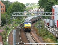 A GNER Kings Cross - Glasgow Central service photographed shortly after leaving the E&G main line at Haymarket East Junction in July 2006. The train is about to pass below Slateford Road heading south west towards Carstairs.<br><br>[John Furnevel 27/07/2006]