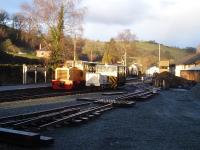 Diesel loco and rolling stock, including what appears to be a works mess unit, are seen in this view over Llanfair Caereinion yard, looking towards the station, during the winter closure period.<br><br>[David Pesterfield 20/01/2014]