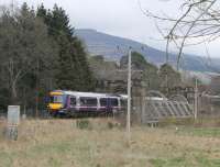 Passing through the ornate bridge over the River Tilt, 170405 slows to call at Blair Atholl on 5 April. The Turbostar was on a Glasgow Queen Street to Inverness service.<br><br>[Mark Bartlett 05/04/2014]
