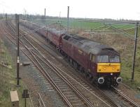 A West Coast class 47 brings the 06.47 ex-Cleethorpes <I>'Edinburgh - Settle & Carlisle'</I> special out of Quintinshill down loop on 12 April 2014. The train was scheduled to return south from Edinburgh later in the day via the ECML.<br><br>[Kevin McCartney 12/04/2014]