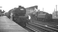 Scene on platform 1 at Carlisle on 4 August 1962, as Stanier Princess Pacific no 46208 <I>Princess Helena Victoria</I> comes off the recently arrived 9.20am Crewe - Aberdeen. Standing in the west sidings is Ivatt 4MT 2-6-0 no 43027.<br><br>[K A Gray 04/08/1962]