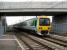 Heading west for Birmingham, 323207 arrives at Tile Hill on 24 March 2007. The new bridge has replaced the level crossing which used to be just in front of the EMU.<br><br>[John McIntyre 24/03/2007]