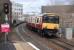 318259 enters Partick with an eastbound service on 22 February.  The platforms of the earlier station survive in the background beyond the Dumbarton Road bridge. <br><br>[Bill Roberton 22/02/2014]