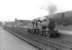 2P 4-4-0 no 40670 on station pilot duty at the north end of Dumfries on 5 September 1961. Note the signal boxes, ancient and modern, in the left background and the vans in the high level goods yard on the right.<br><br>[David Stewart 05/09/1961]