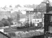 An EE Type 3 brings a ballast train through Gorgie Junction and onto the sub in the spring of 1975. Running off to the right is the spur to Haymarket Central Junction. <br><br>[John Furnevel 27/05/1975]