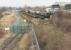 Looking towards the entrance to Long Marston ex-MoD Depot and the exchange sidings on 3 March 2014. The former mainline trackbed is to the left of the perimeter fence heading towards the brown and white building in the distance and on towards Stratford-on-Avon.<br><br>[John McIntyre 03/03/2014]