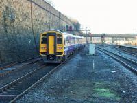 The 1:50 gradient out of Bradford Interchange starts before the end of the platform but units such as the Class 158s are well on top of the job. 158755, on a Blackpool to York service, has just reversed in the station and heads back up the hill as a sister unit, partially hidden by the bridge, drops down towards the platforms.  <br><br>[Mark Bartlett 24/03/2014]