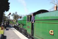 A pleasant spring day at Crowcombe Station on the West Somerset Railway on 13 April 2014. Nicely turned out GWR 4-6-0 no 6960 <I>Raveningham Hall</I> is at the platform.<br><br>[Peter Todd 13/04/2014]