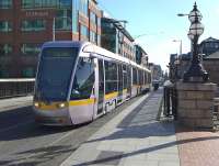 Luas Red Line tram 4012 crosses the Royal Canal on 23 March having just called at the George's Dock stop.<br><br>[Bill Roberton 23/03/2014]