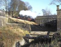 Black 5 No. 45305 forges uphill past Vale Mill with a mid-day <I>Santa Special</I> from Keighley on 30 November 2013.<br><br>[Bill Jamieson 30/11/2013]