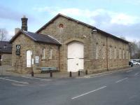 The former goods yard at Hawes was forward of the station building on the south side of the line. The restored goods shed is now linked to the station building, seen in the left background, as part of the Dales Countryside Museum.<br><br>[David Pesterfield 21/04/2014]