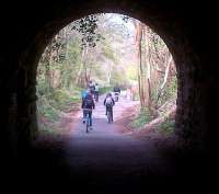 Looking North under the covered way towards Tucking Mill viaduct, the increase in traffic on the cyclepath since Combe Down and Devonshire tunnels were re-opened is evident. [See image 43820]<br><br>[Ken Strachan 19/04/2014]