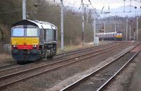 DRS 66428 has the <I>feather</I> for Coatbridge container terminal having run light from Mossend. In the background DBS 66132 approaches with empty coal hoppers from Longannet to Hunterston. [Ref query 7619]<br><br>[Bill Roberton 17/04/2013]
