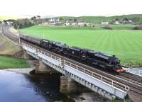 Crossing Crawford Viaduct on 29 April 2014, almost two hours behind the <I>Great Britain VII</I>, Black Fives 44871 and 45407 head north with the support coaches in readiness for the trip to Stranraer the following day.<br><br>[John Gray 29/04/2014]
