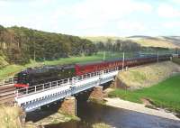 Rebuilt Royal Scot No.46115 <I>Scots Guardsman</I> crossing the viaduct at Crawford on its way to Edinburgh with the <I>Great Britain VII</I> on 29 April 2014. The ruins of Crawford Castle stand beyond the trees in the background.<br><br>[John Gray 29/04/2014]