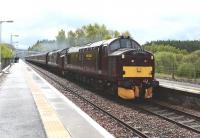 37685 <i>Loch Arkaig</i> and  37516 <I>Loch Laidon</i> pass through Carrbridge in the rain on 10 May with an SRPS Railtour from North Berwick to Kyle of Lochalsh.<br><br>[John Gray 10/05/2014]