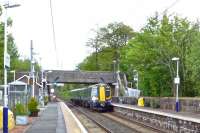 The 14.30 Glasgow Central - Ayr dashes through Lochwinnoch at high speed on 14 May. This train's first stop will be at Kilwinning and the end to end journey time is a scheduled 48 minutes.<br><br>[Colin Miller 14/05/2014]
