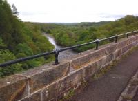 Looking North up the South Tyne from the former Alston branch viaduct, which closed to all traffic in 1976; but was restored and reopened as a footpath in 1996. Cycle access is possible, but not recommended as a through route; as the footpath diverts down steps at the South end of the viaduct.<br><br>[Ken Strachan 22/05/2014]