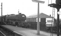 Stanier Pacific 46208 <I>Princess Helena Victoria</I> brings the 9.20am Crewe - Aberdeen into Carlisle on 4 August 1962. The train is passing the former Maryport & Carlisle Railway's Bog goods depot (1852) [see image 22574].<br><br>[K A Gray 04/08/1962]