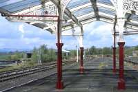 The recently restored canopy at Hellifield makes a very attractive frame for the various signals on the down side. This end of the island platform has not been raised as part of the refurbishment works and is no longer used, although it can still be accessed when the tearoom is open.<br><br>[Bill Jamieson 14/04/2014]